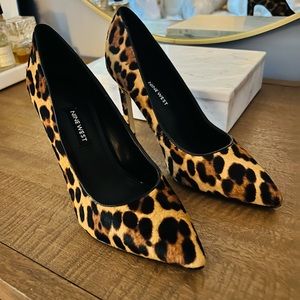 Nine West leopard print pointed toe pumps.
